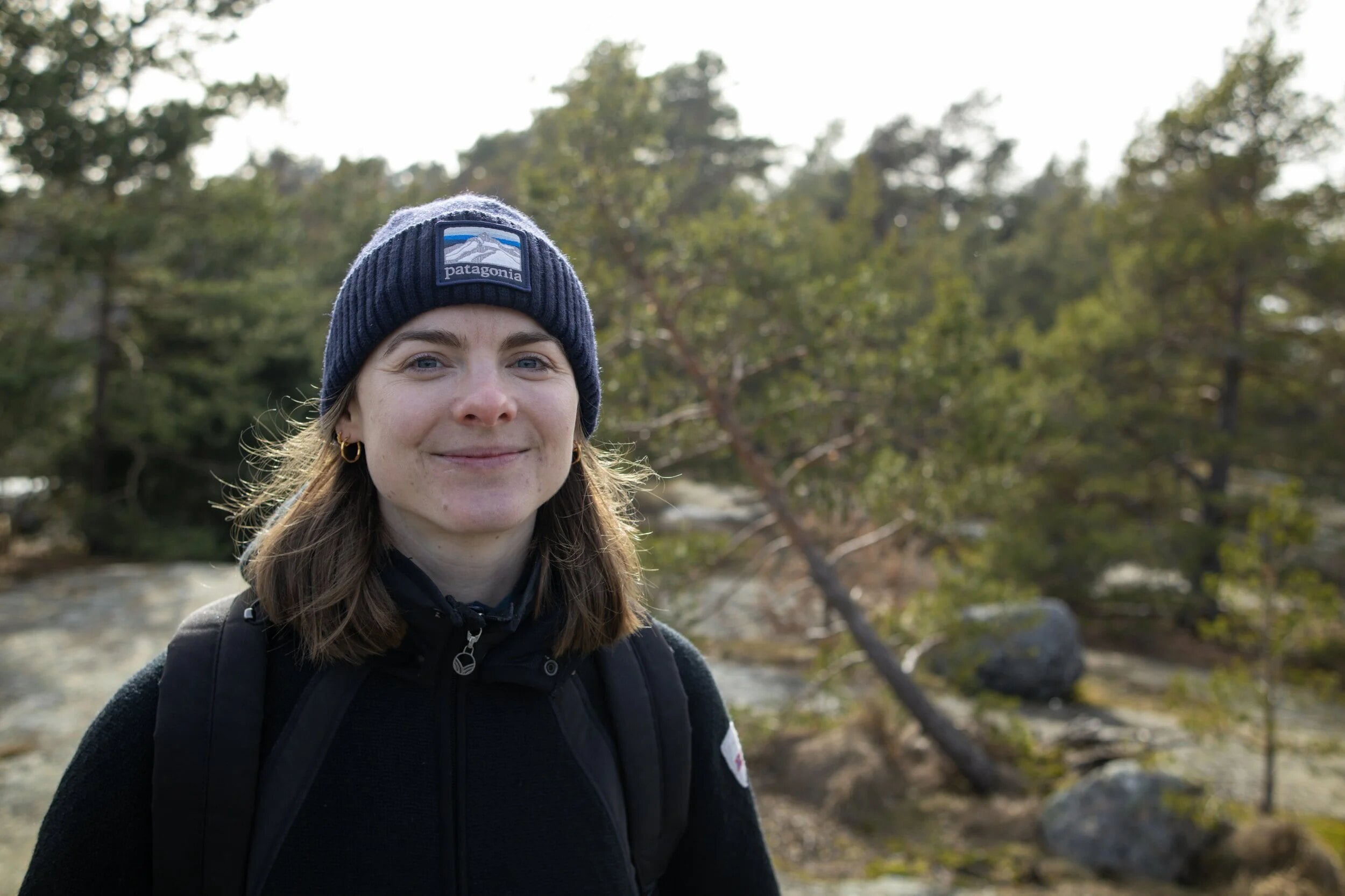Zael outdoors in a woollen hat